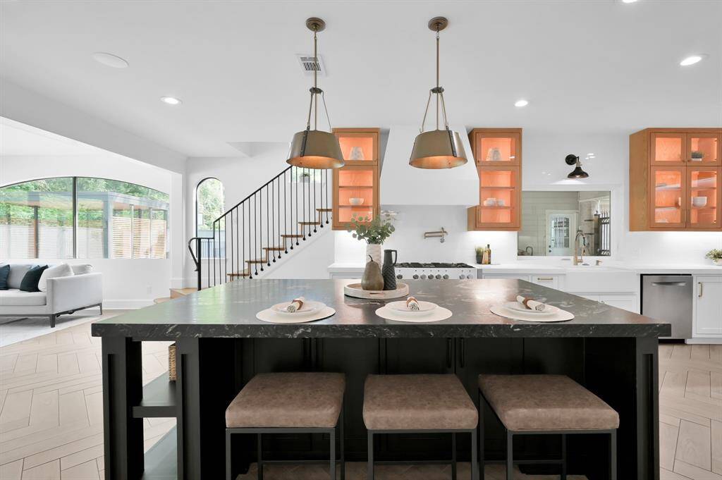 The oversized island features beautiful leathered granite and breakfast seating.
