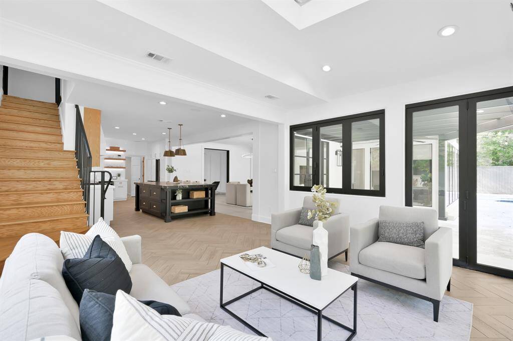 Sunroom off kitchen, showcasing the second staircase to second floor.