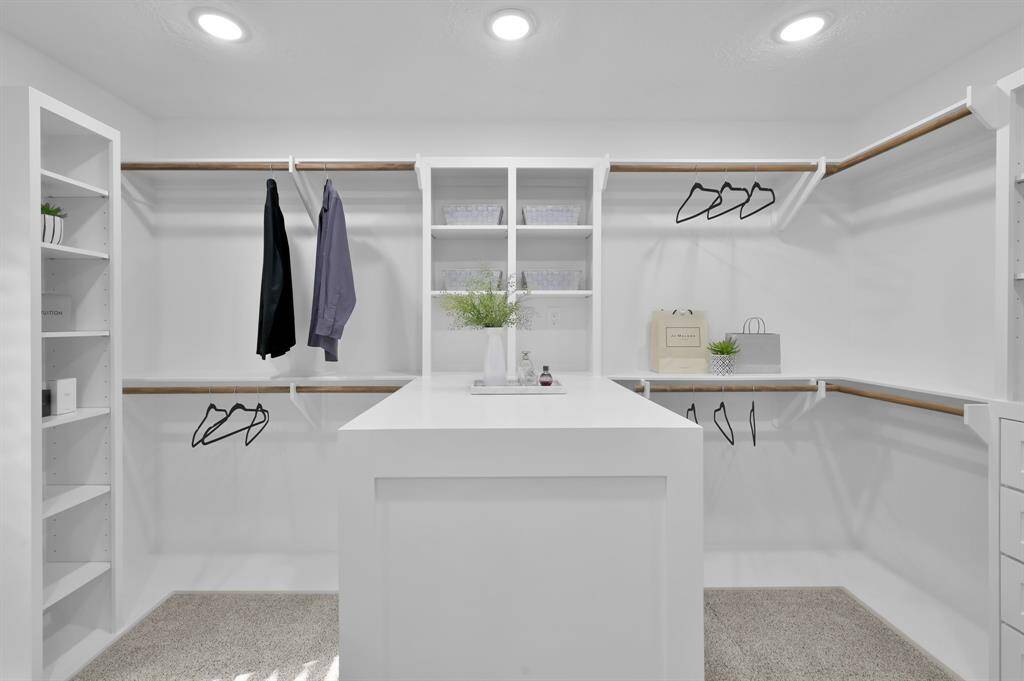 Notice the spacious glass-enclosed shower and freestanding tub for ultimate spa-like elegance.