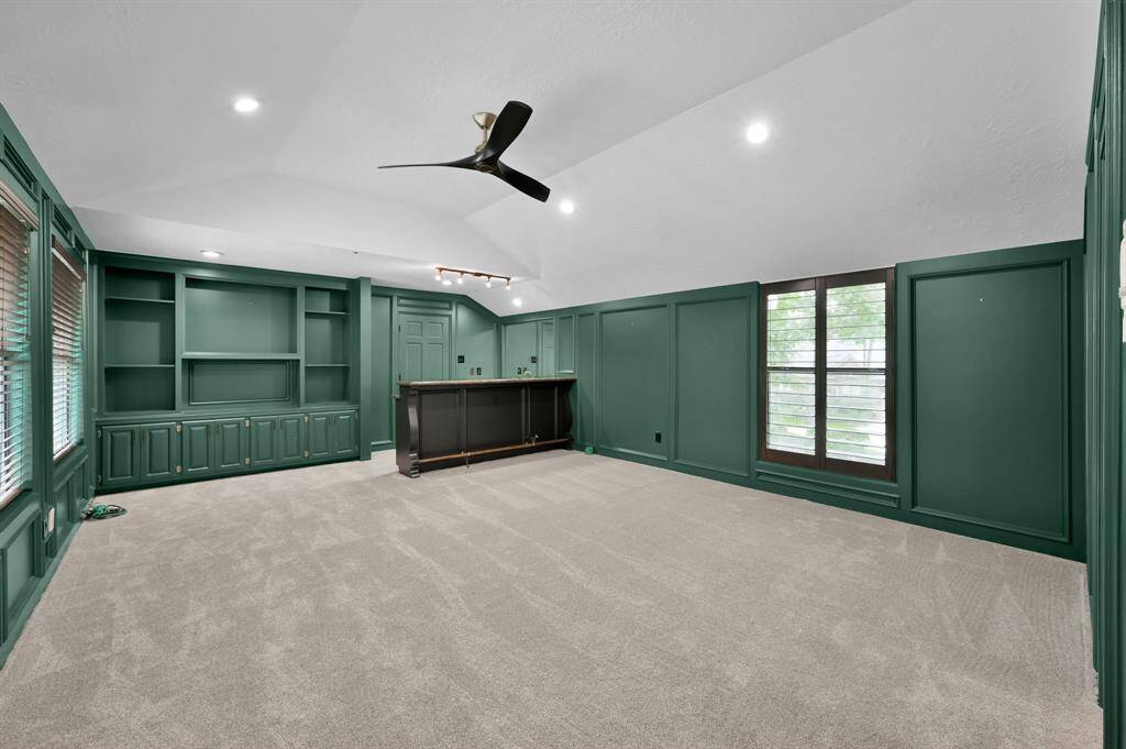 Upstairs bedroom #4 includes a built in desk with  storage drawers and access to a full bathroom.
