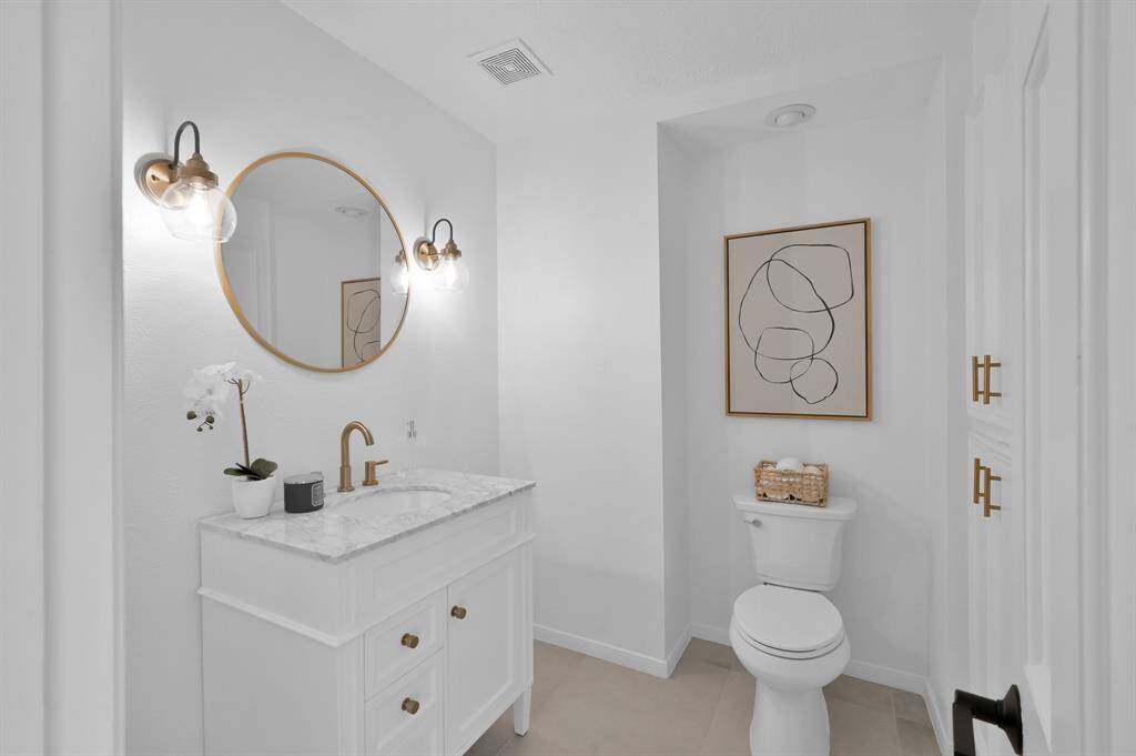 This view of the game room shows entry to the full bathroom shared with bedroom #4