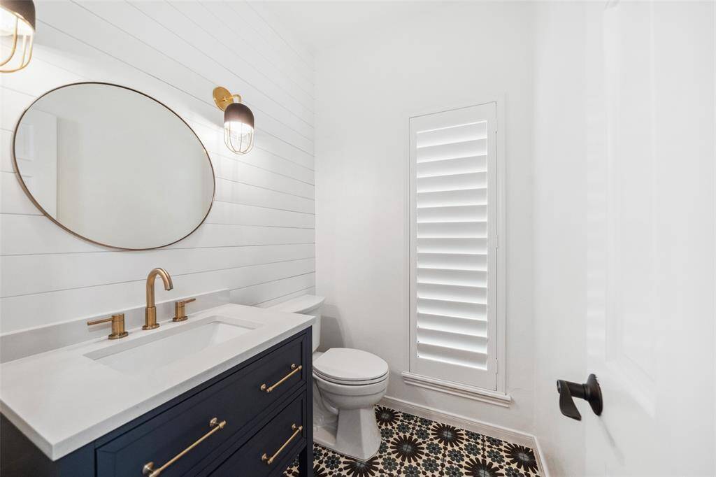 Full bathroom between game room and upstairs bedroom #4 has pedestal sink and stand up shower.