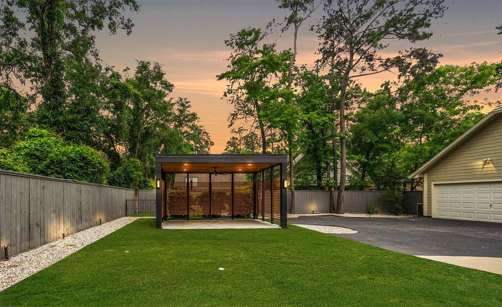 Large windows and sleek architectural elements enhance the contemporary design.