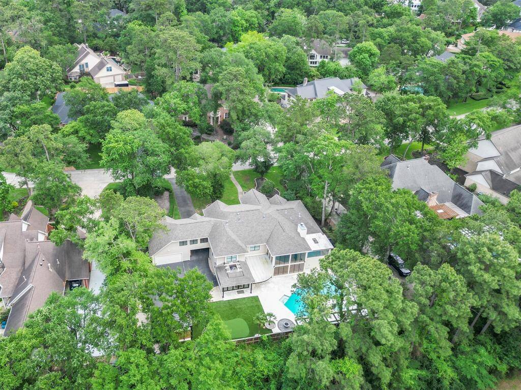 The wooded backdrop of the neighborhood is perfect for those seeking a tranquil, upscale community near the golf course.