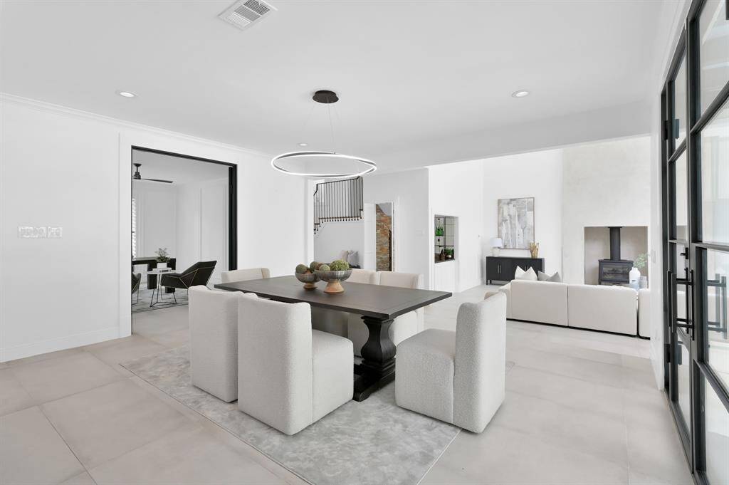 Formal Dining area sits conveniently between the kitchen and living room, with office in the background.
