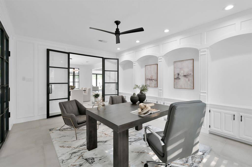 The office is very spacious with updated lighting and plenty of built in storage.