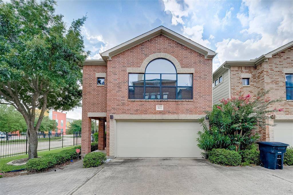 A charming brick façade with an expansive arched window makes an impression at this corner patio home. The recessed entryway provides privacy, and the two-car garage ensures convenience while also adding curb appeal.