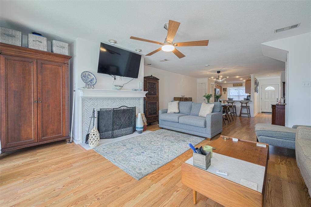 view from sliding glass doors looking towards kitchen/dining area)
