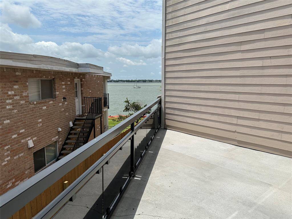 Peekaboo view of lake from living room and first Floor balcony