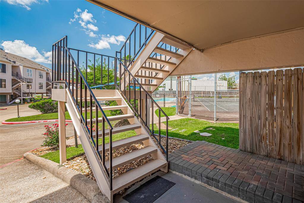 Stairs leading up to the front door of the unit..