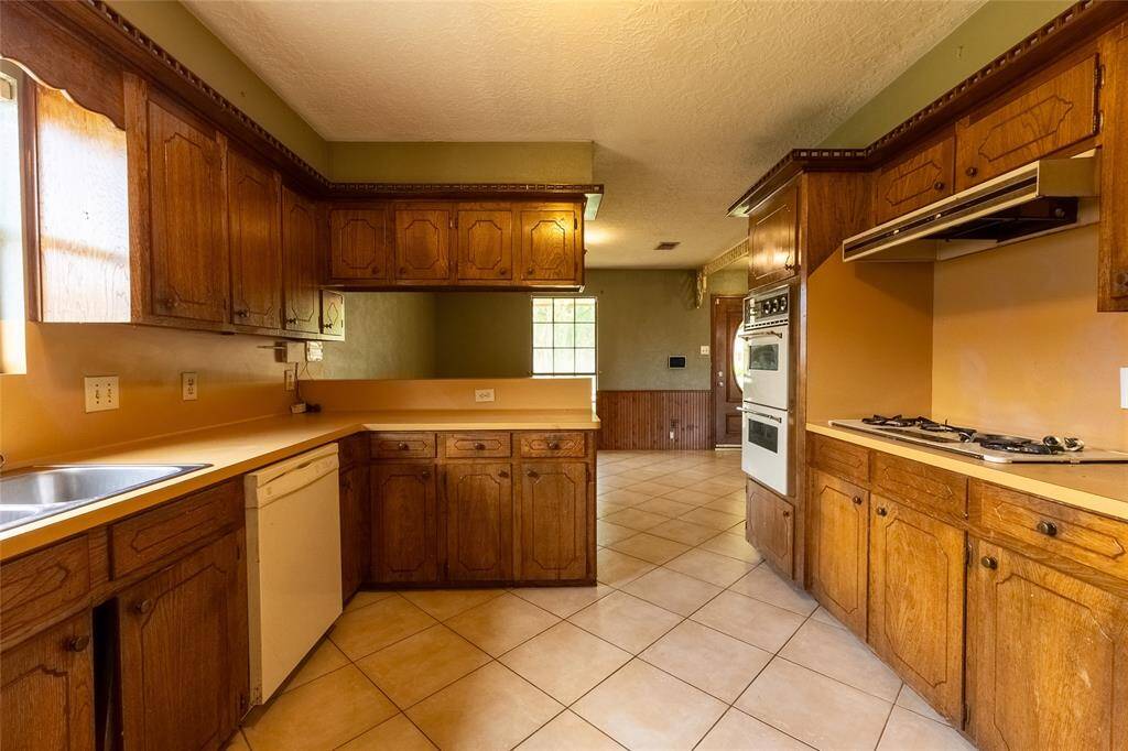Kitchen - will be updated with granite counter tops ,new appliances, and new cabinets