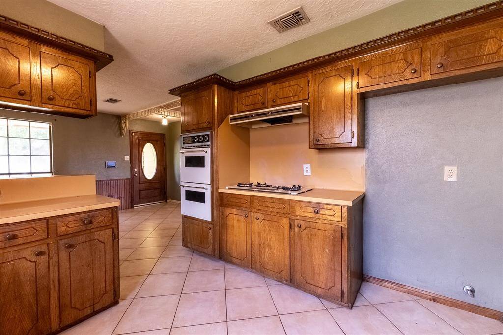 Kitchen - will be updated with granite counter tops ,new appliances, and new cabinets