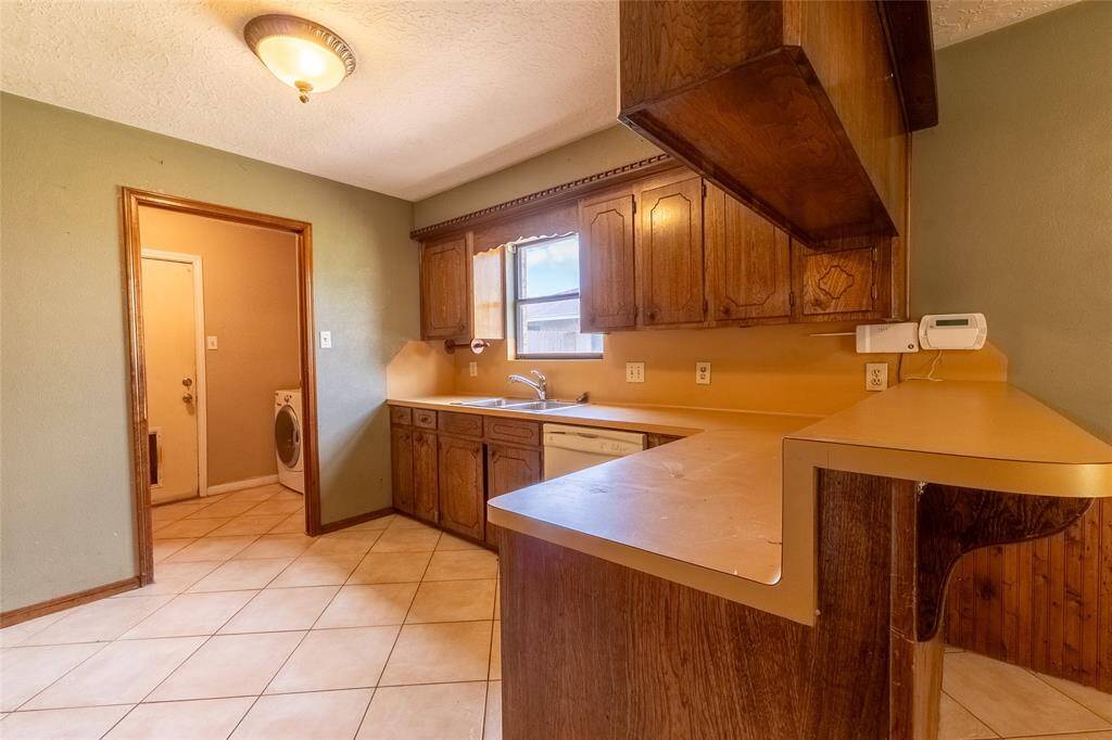 Kitchen - will be updated with granite counter tops ,new appliances, and new cabinets