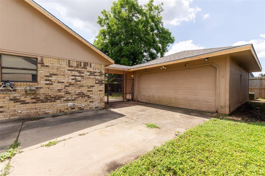 Garage and gate to back yard