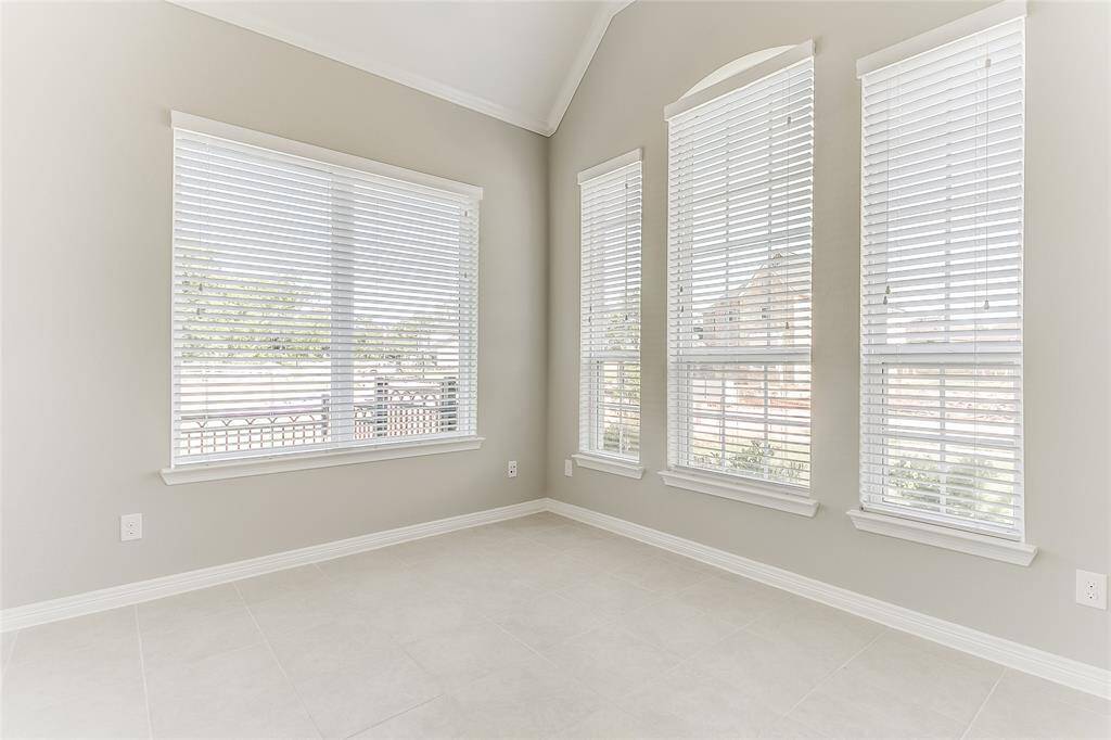 Another View of the Sophisticated Study that allows Plenty of Natural Lighting through multiple windows and an abundance of space to work in privacy.