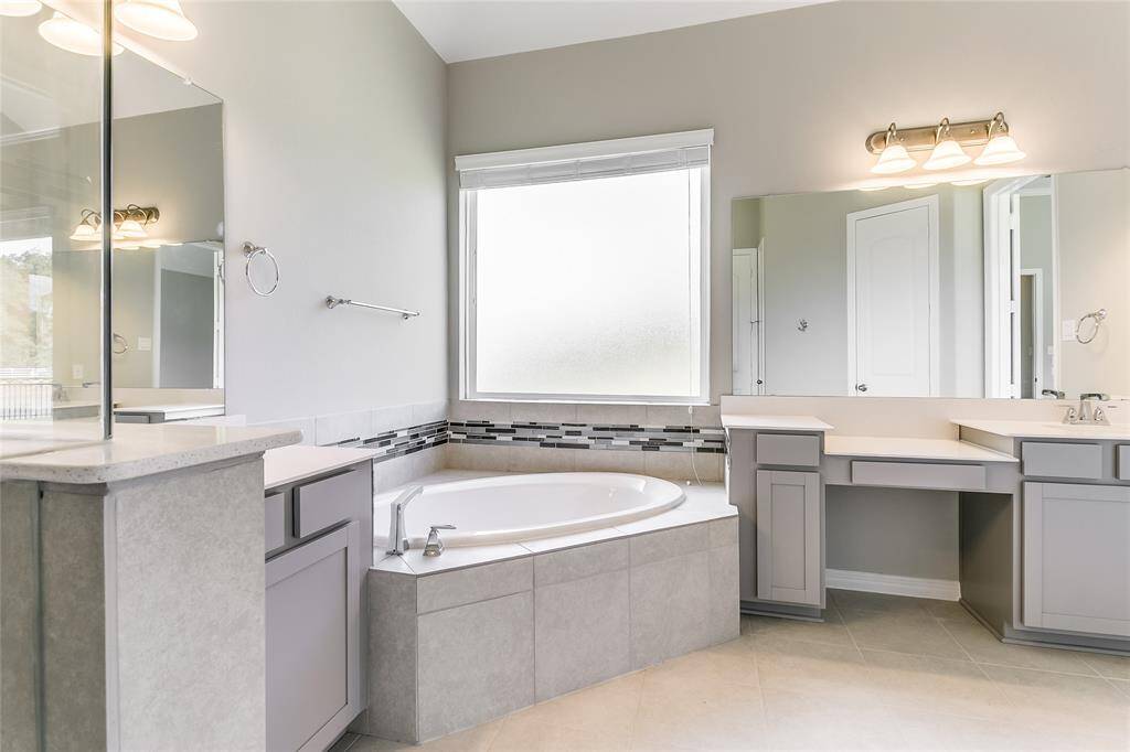 Primary Oasis offers double sinks and vanity area, making it easy for getting ready in the morning !