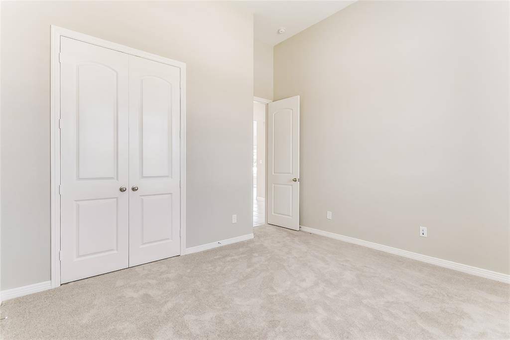 Another view of the spacious secondary bedroom that is accomanied with a large closet to hold all of your wardrobe!