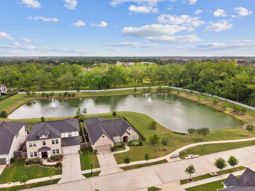 Wonderful view that exhibits the beautiful surrounding homes and path leading to the serene Lake around your very own home!