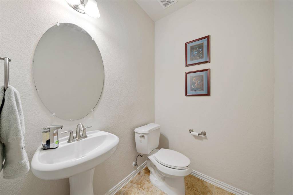 This well-appointed half bathroom is great for when you have family, friends, and guests over.