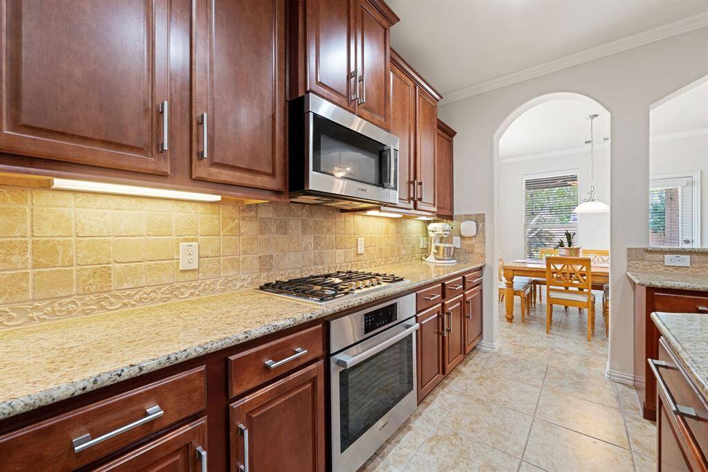 The kitchen flows seamlessly into the dining and living room areas.