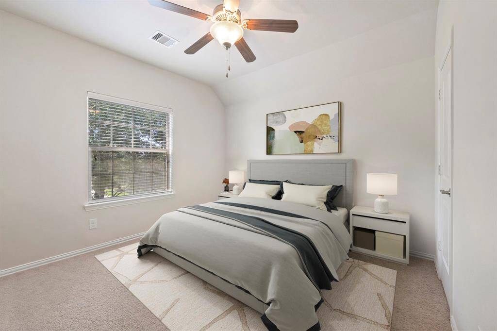 Virtually Staged: Secondary bedroom with carpet floors, windows with privacy blinds, a ceiling fan, and a built-in closet.