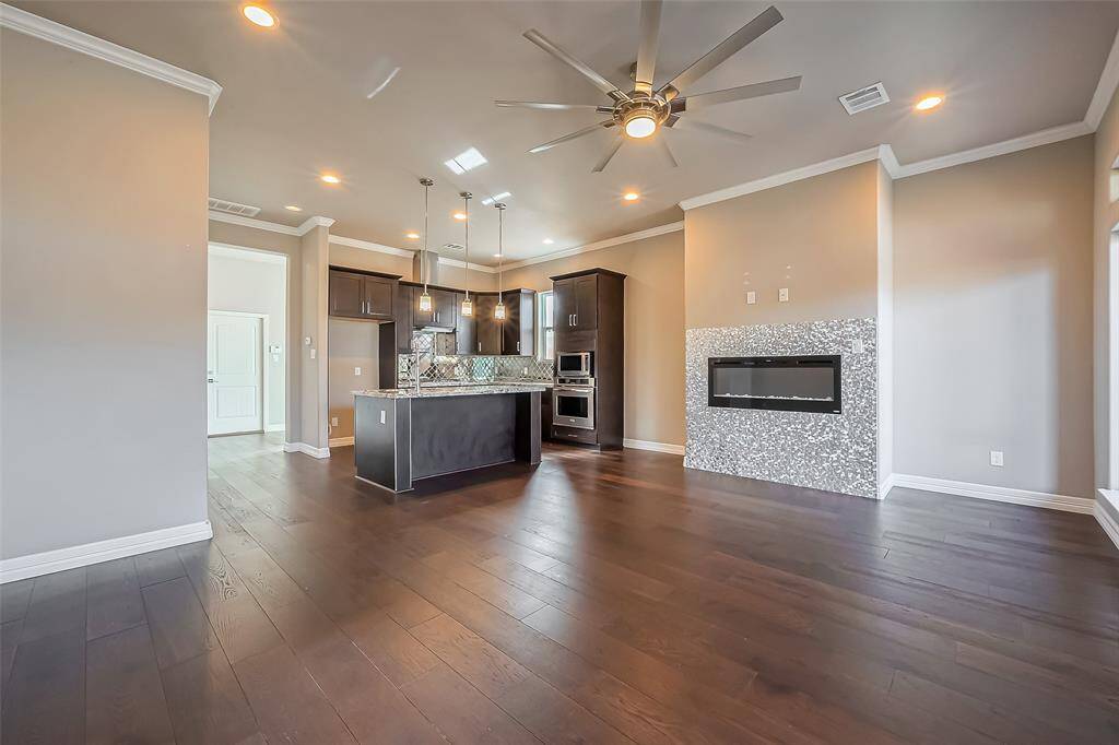 From this view of the living room, you can enjoy the open concept which helps to make this area more functionable.