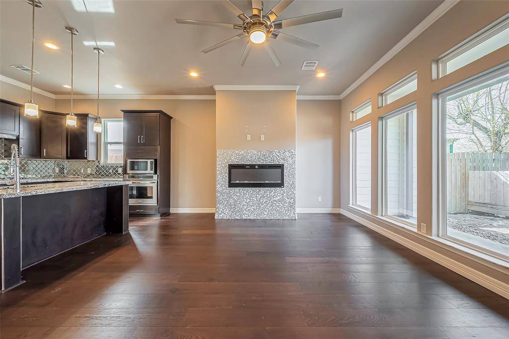 The living room has a built-in electric fireplace with a remote that adds great ambiance and heat when needed.