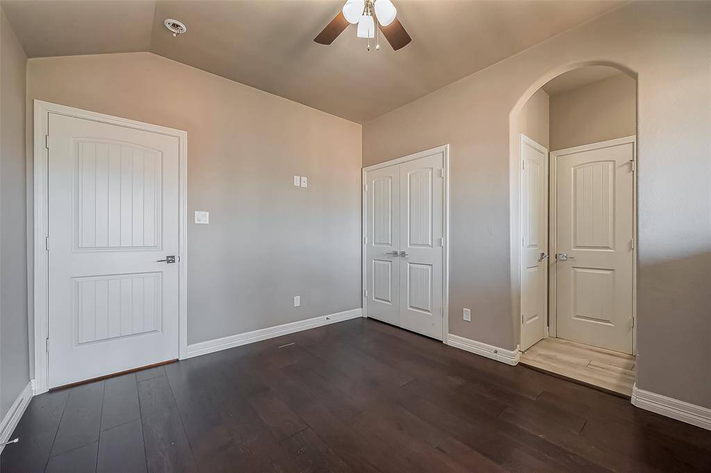 Room #2 and room #3 are a Jack and Jill bathroom. Each bathroom has gray and white laminate floors along with beautiful dark wood laminated floors in the bedrooms.