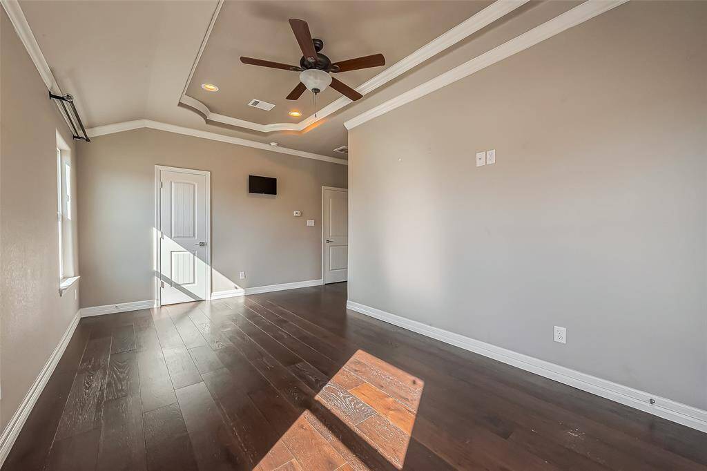 In the closet of the primary bedroom holds an area for the security system.