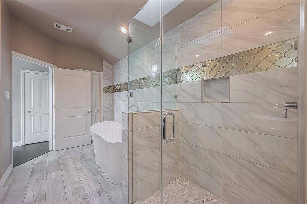 This shower is a double shower with cutouts for shampoo, and bath gel.