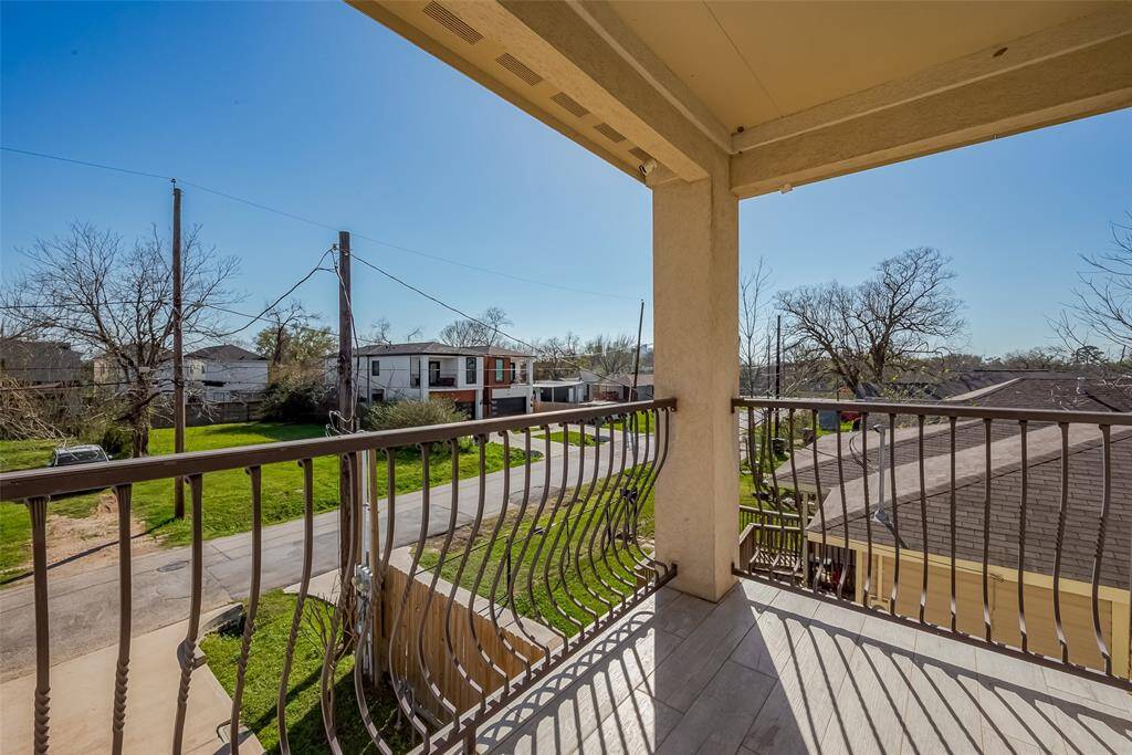 The primary balcony has a two sided metal railing,