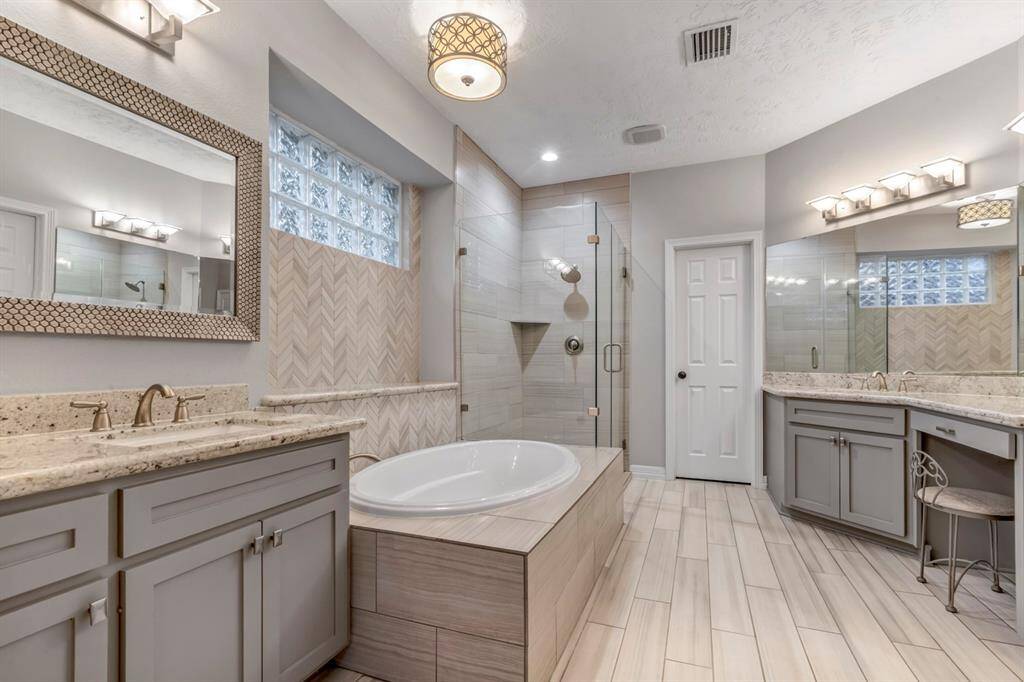 Not only does the primary en suite feature double vanity, but also double walk-in closets.