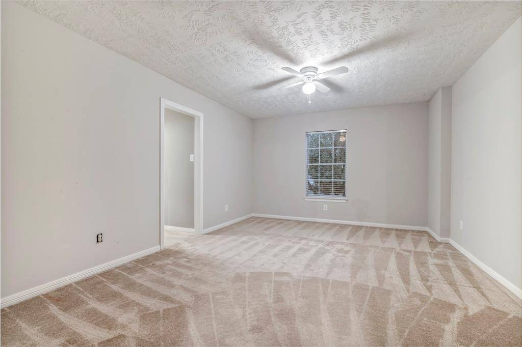 This secondary bedroom has a Hollywood style bathroom with private vanity.