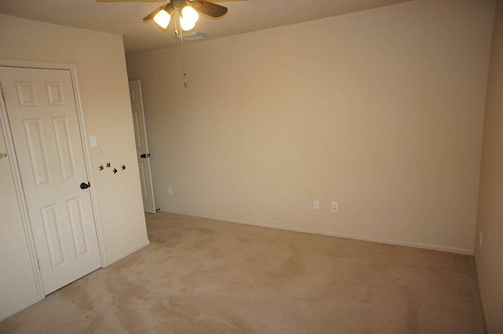 Standing in corner of secondary bedroom.