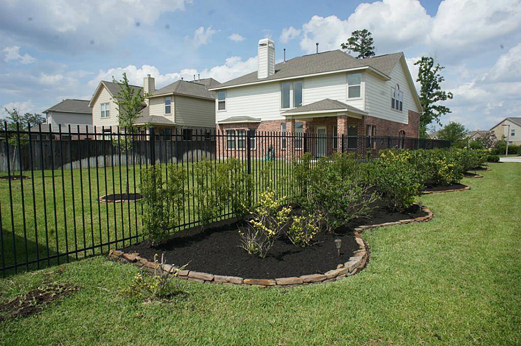 Beautiful landscaping located in the front, back, and side of the home.