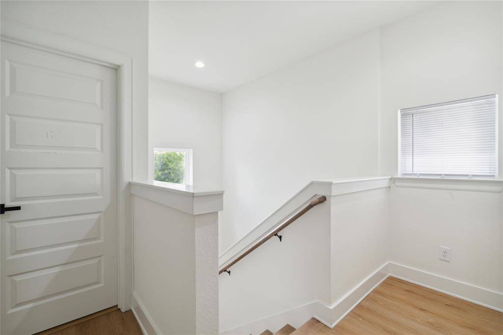The third-floor stairs guide you to the spacious third bedroom, the luxurious primary bedroom, and a convenient utility room, creating a private and functional level of the home. It’s the perfect layout for both comfort and practicality