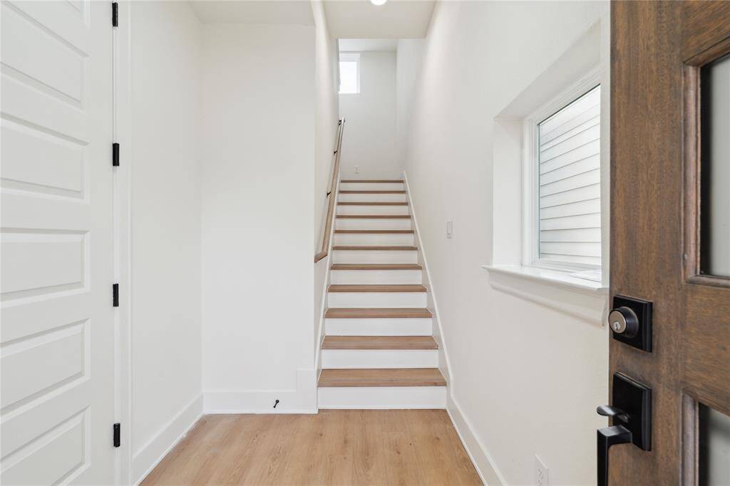 Welcome home to a sleek foyer that greets you with clean lines. Head straight to your spacious 2-car garage or make your way upstairs to the heart of the home.