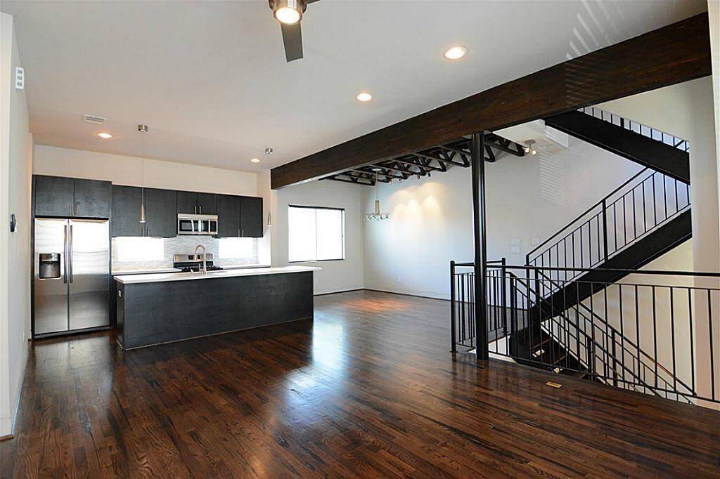 2nd floor- wide angle view to showcase family area, kitchen and dining place