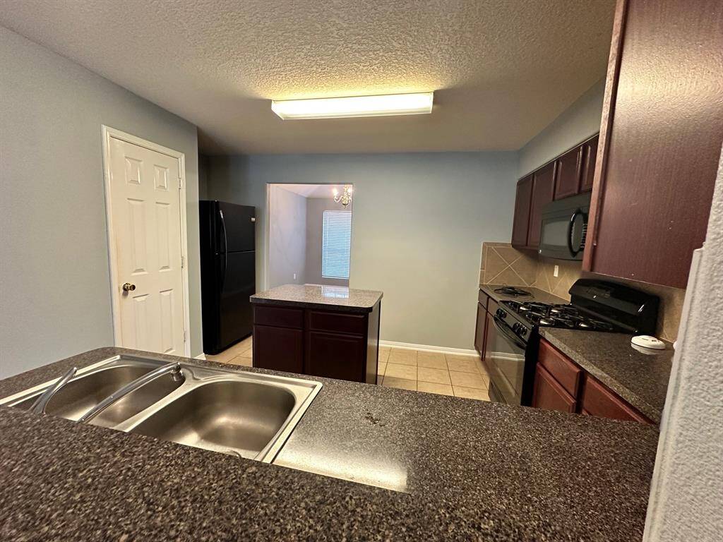 Another view of kitchen.. Fridge stays