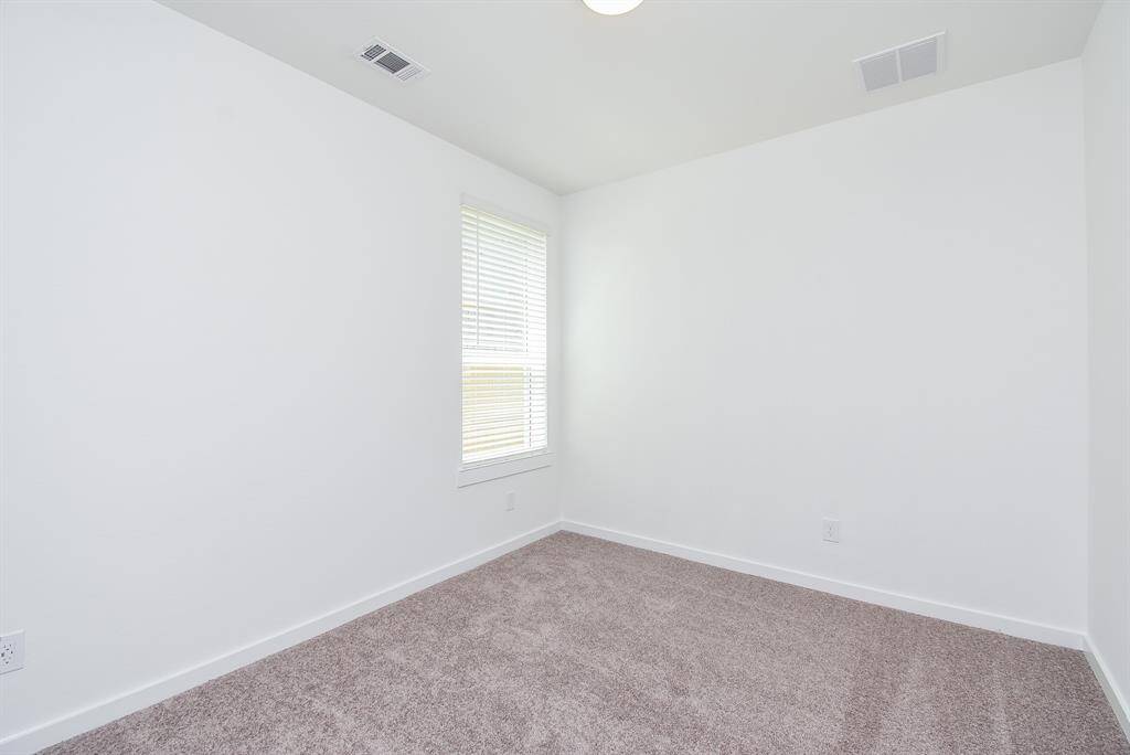 Here's another look at a secondary bedroom; any of which may be used for specific needs (besides sleeping); like a nursery, hobby room, work out space? It's all up to you.
