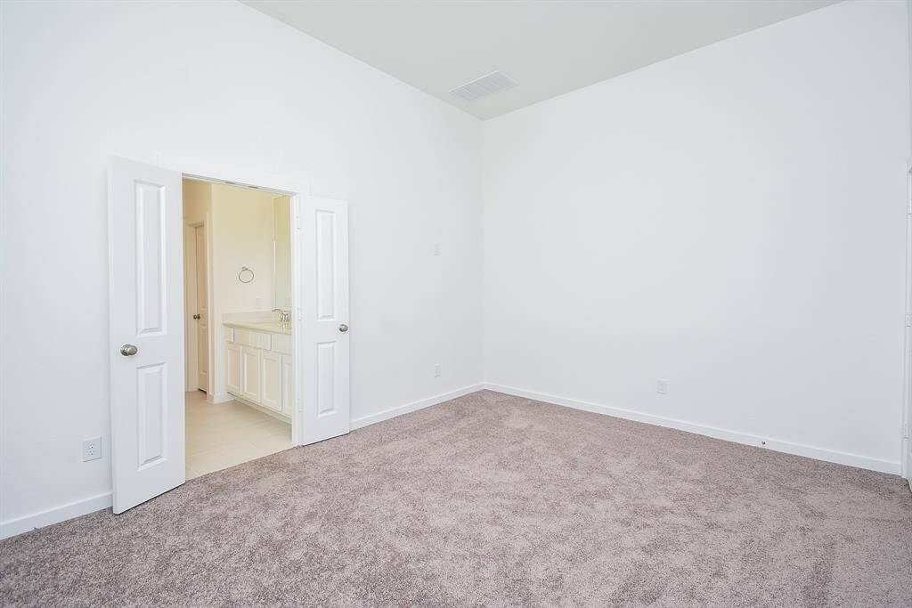 Double doors, left, open onto your primary ensuite bath.