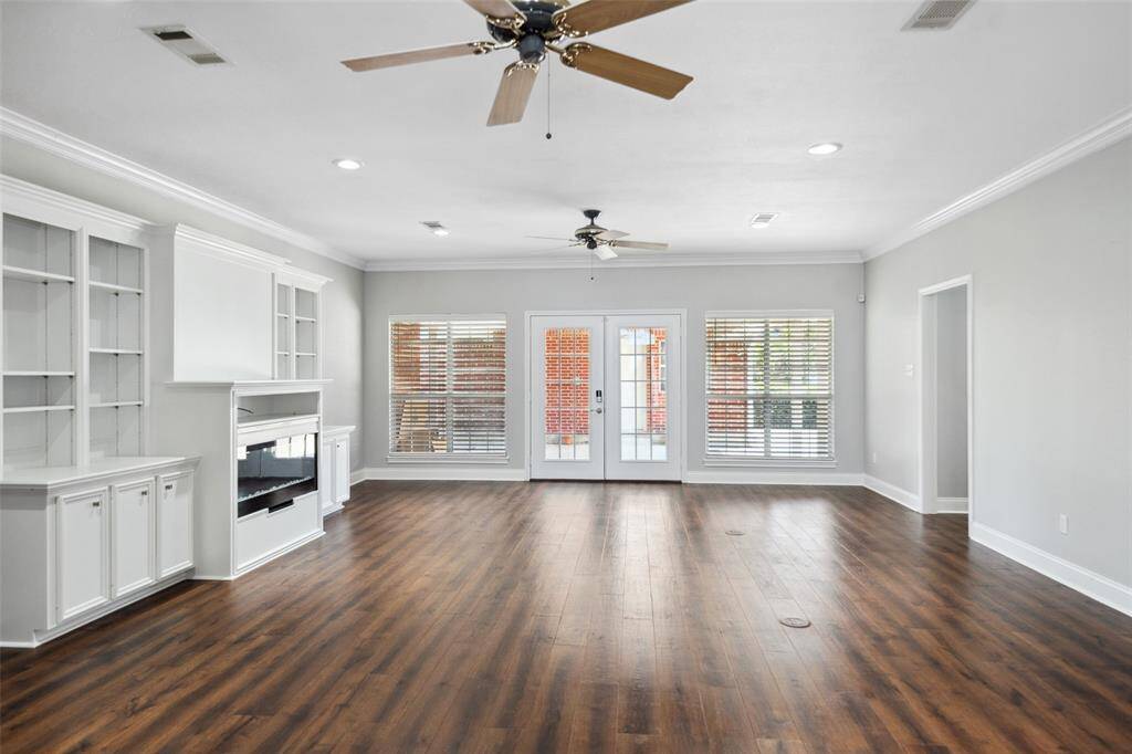 Double French doors lead to the covered rear patio area.