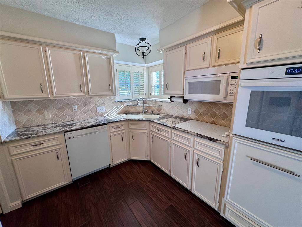 The kitchen sink has a view of the beautiful park next door!