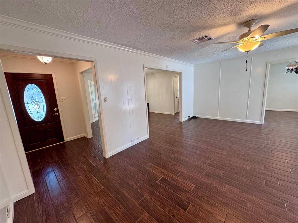 Pretty foyer opens to living room and dining room