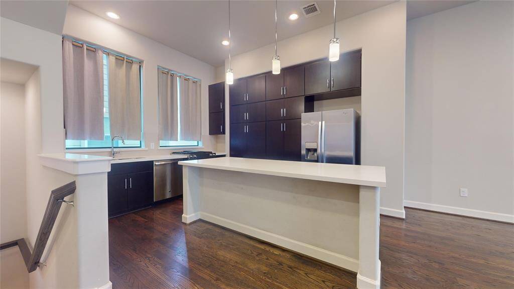 Beautiful kitchen with quartz countertops, ample cabinet/storage space and stainless appliances...