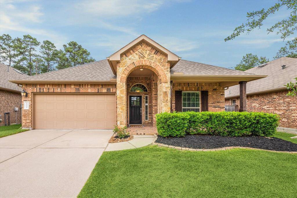 Charming and inviting exterior with lush landscaping and a welcoming entryway.