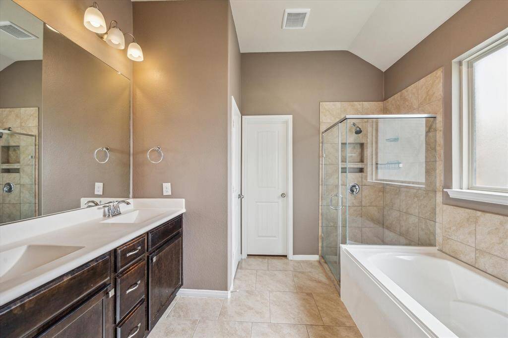 Primary Bath with Double Vanity, Seperate Shower, and Soaking Tub.
