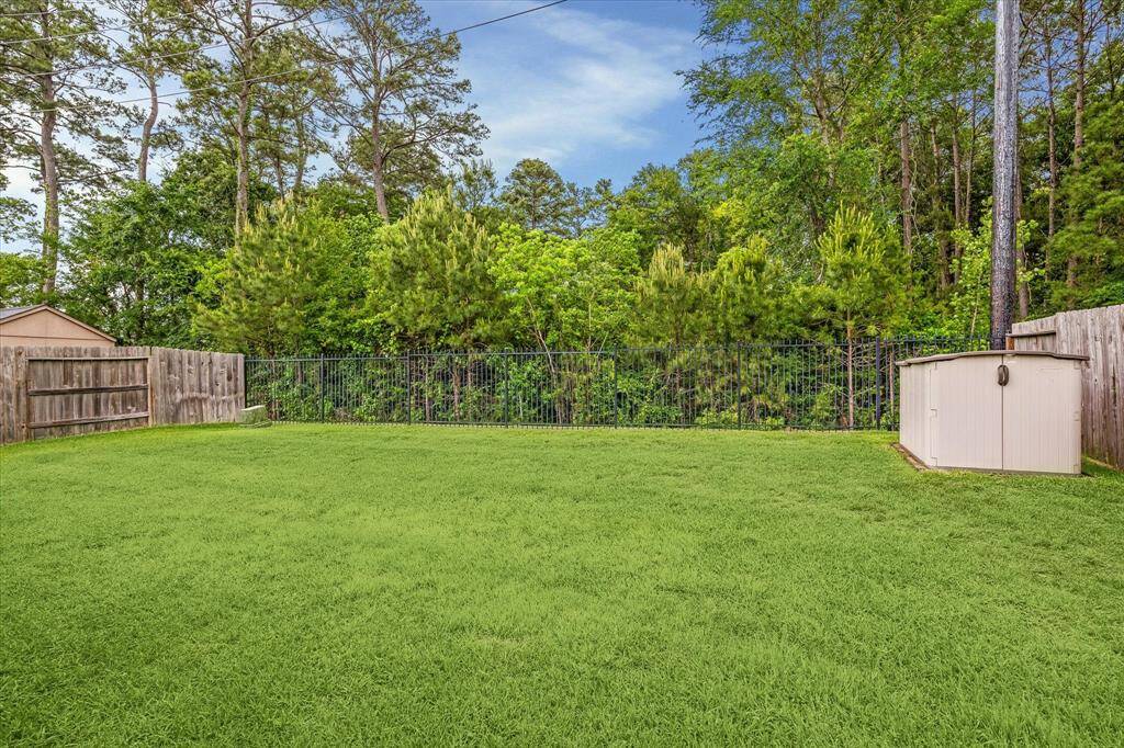 Serene backyard with lush greenery and peaceful views.