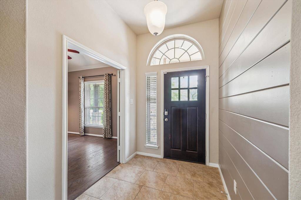 Stunning entryway with elegant lighting and an inviting atmosphere.