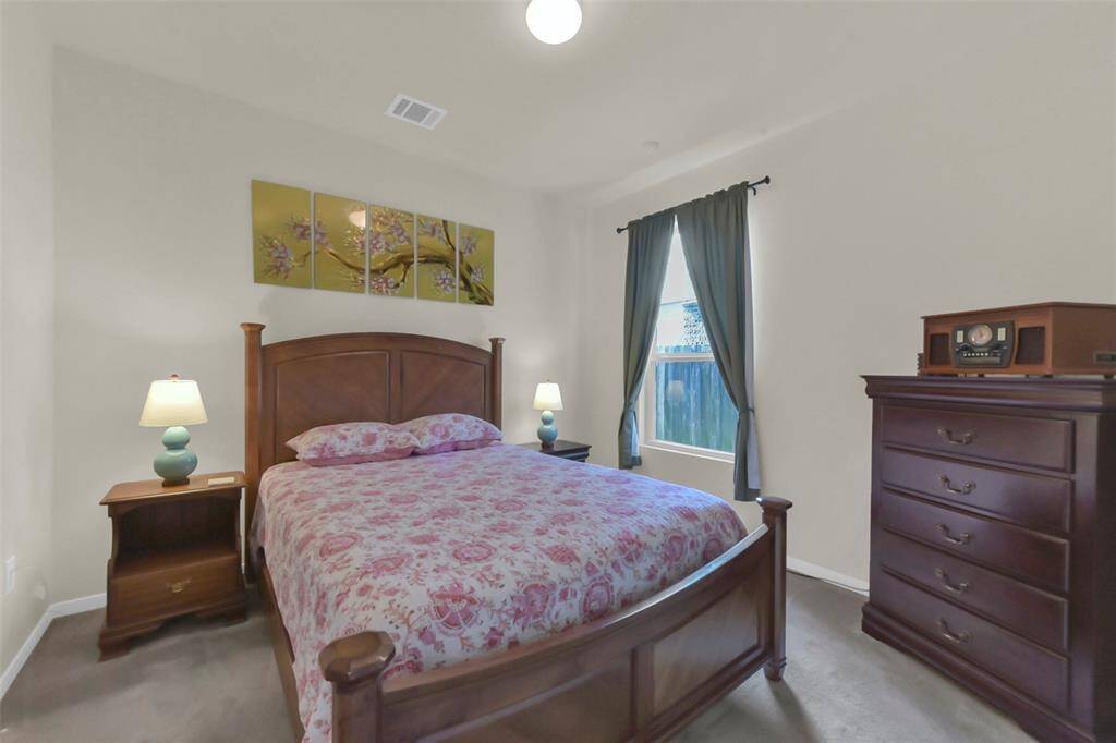 The downstairs bedroom with the full bathroom